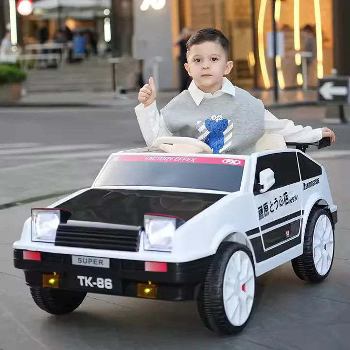 Child sitting in a toy car on a city street