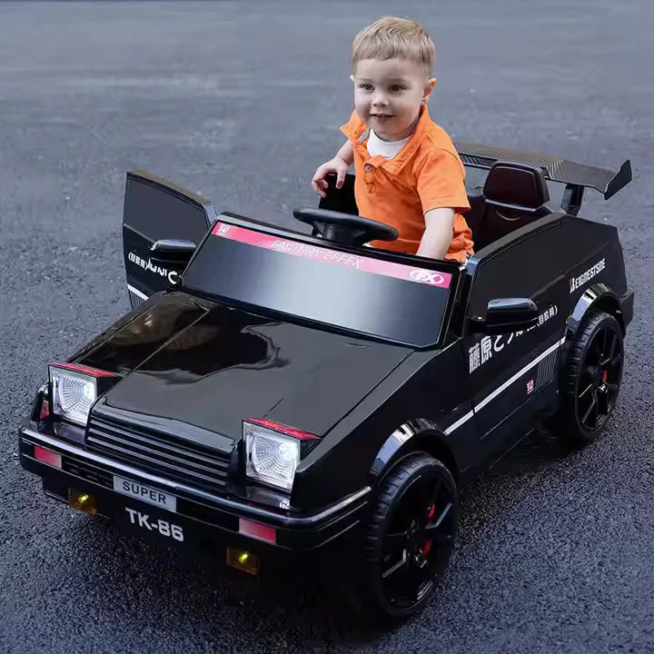 Child sitting in a toy car on a road