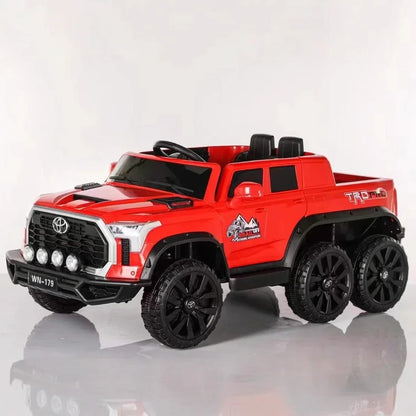 Red toy truck with black wheels on a white background