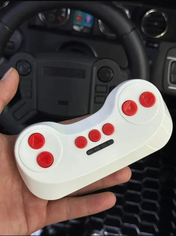 Hand holding a white gaming controller with red buttons in front of a car interior.