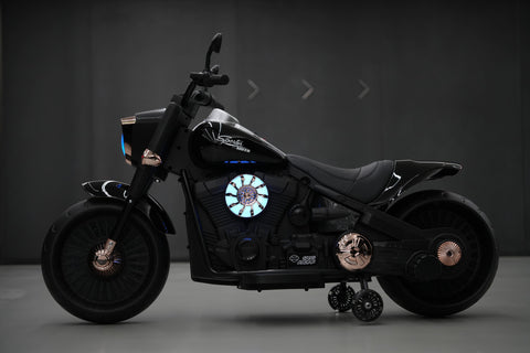 Black motorcycle with glowing emblem on a dark background