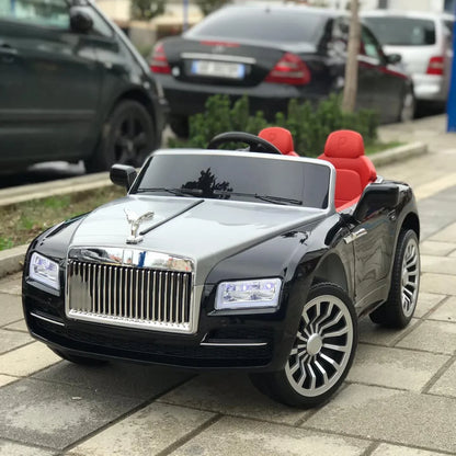 Toy car resembling a luxury vehicle on a sidewalk
