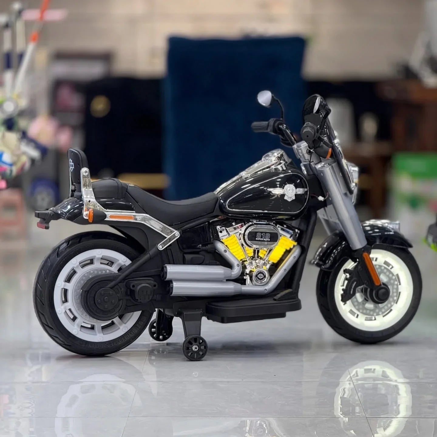 Harley Davidson  Model motorcycle on a reflective surface with a blurred background